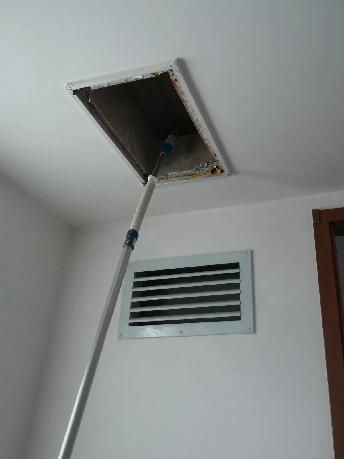 Open supply duct run in a home with a cleaning line entering it
