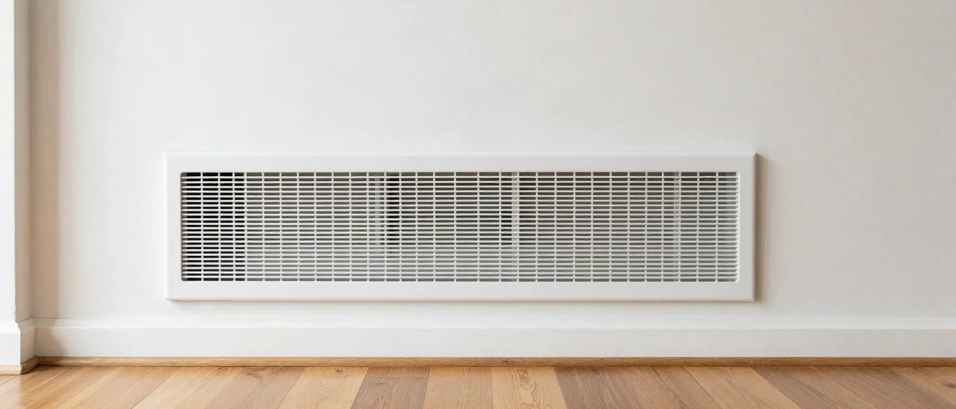 Freshly cleaned air register set into a hallway wall