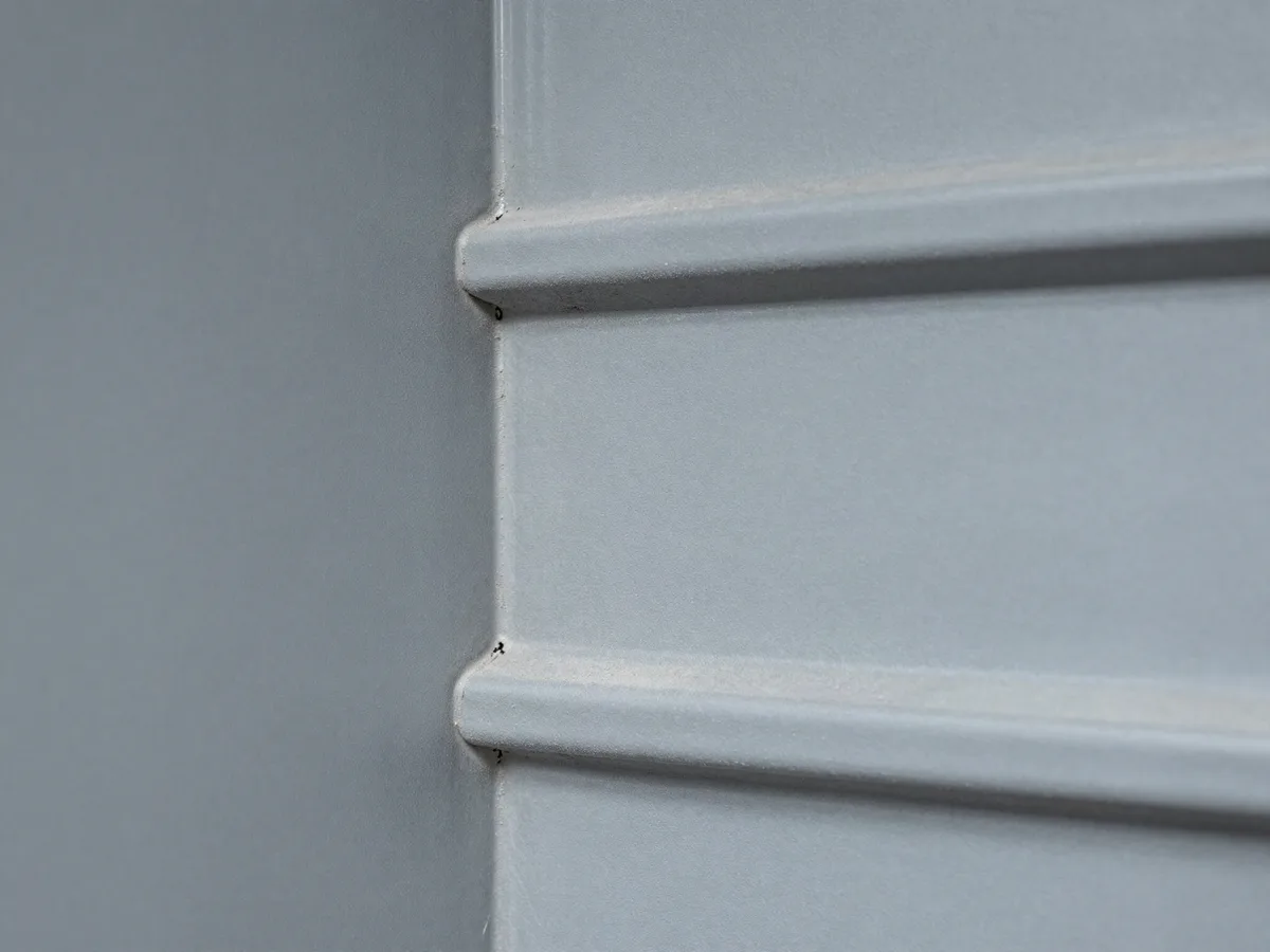 Dust coating the inside wall of a rectangular duct before cleaning
